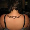 henna design on upper back